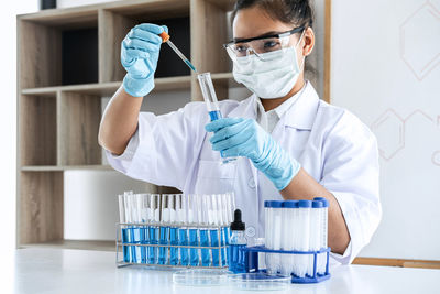 Scientist doing medical research on table in laboratory