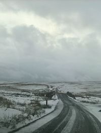 Road against sky during winter