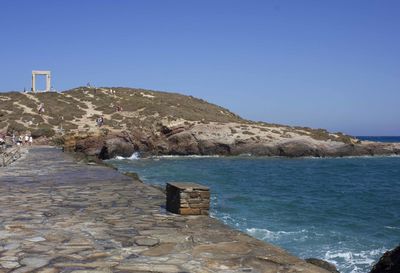 Scenic view of sea against clear blue sky