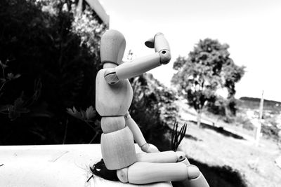 Side view of wooden toy on table outdoors