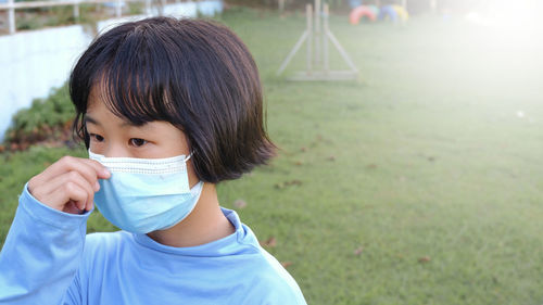 Side view of young woman looking away