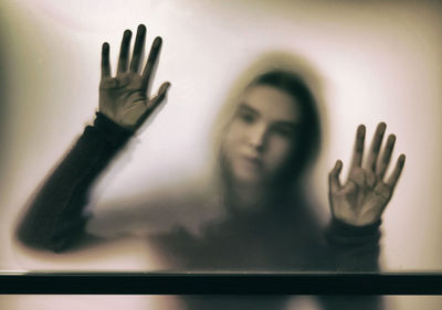 Girl seen through glass window