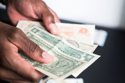 Close-up of hand holding paper