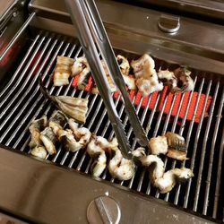 Close-up of meat on barbecue grill