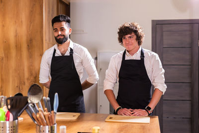 Portrait of smiling male friends working in meeting