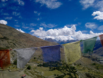 Scenic view of mountains against blue sky