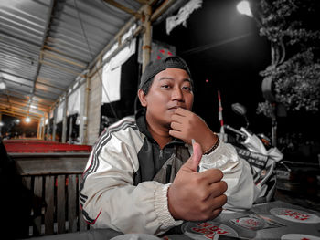 Portrait of boy sitting in restaurant