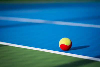 Close-up of ball on tennis court