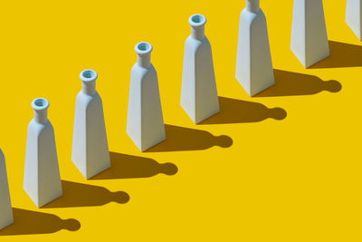 Close-up of yellow painted sign on wall