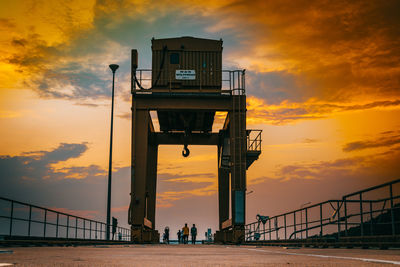 Low angle view of bridge against sky during sunset