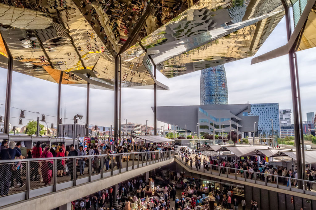 large group of people, architecture, built structure, person, lifestyles, men, building exterior, city, leisure activity, city life, crowd, high angle view, mixed age range, walking, modern, travel destinations, tourist, day, crowded