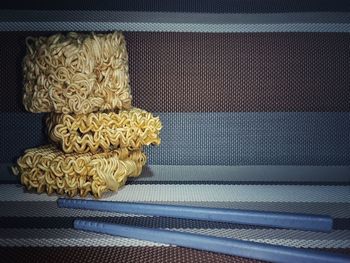 High angle view of yellow stack on table