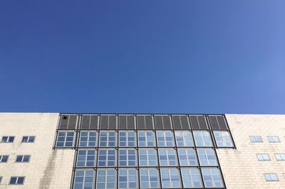 Low angle view of building against blue sky