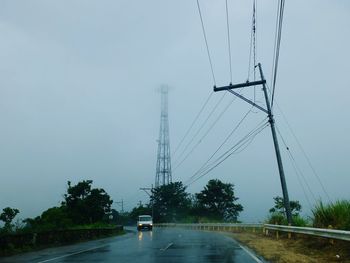 Cars on road against sky