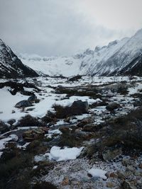 Scenic view of snowcapped mountains against sky