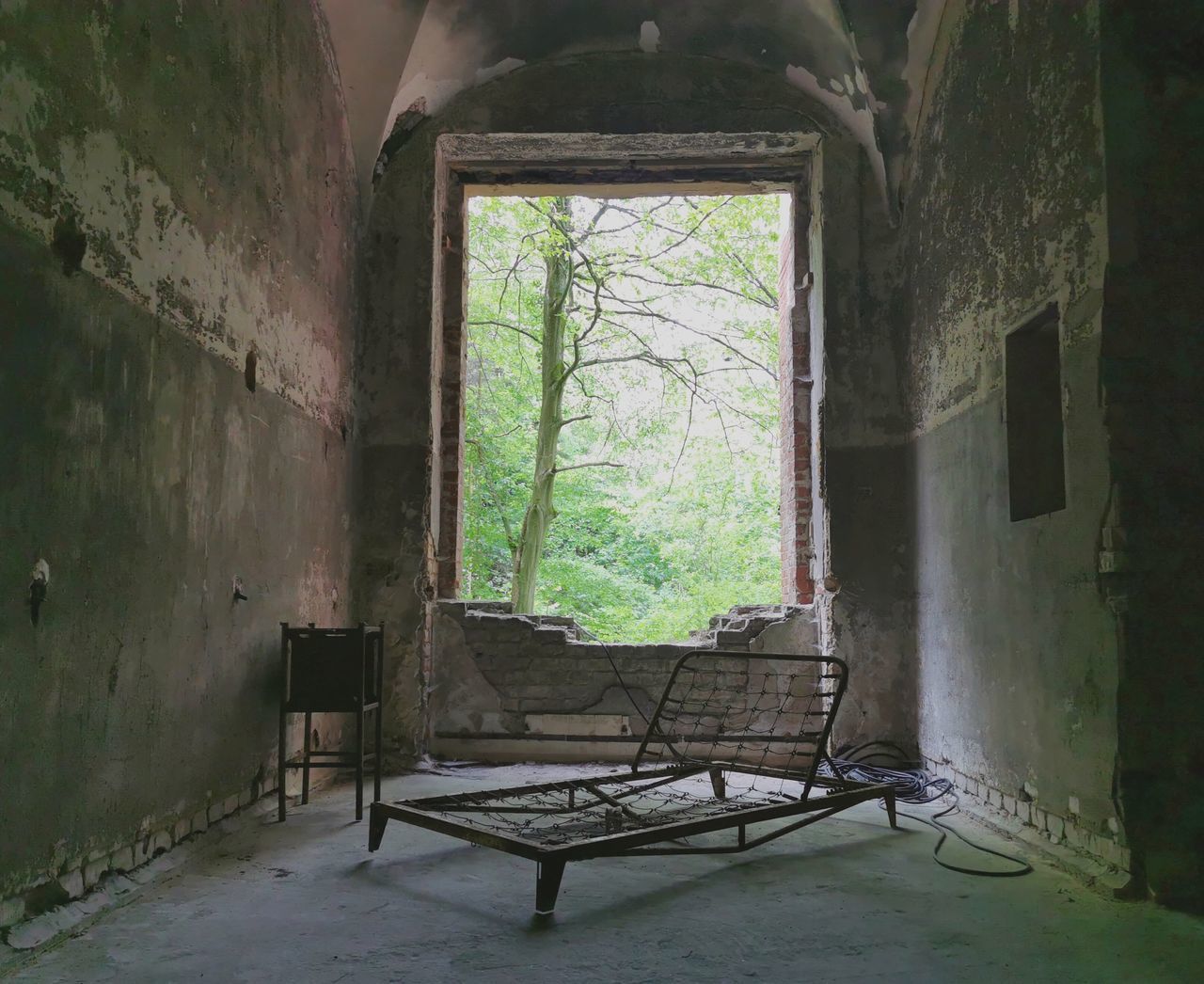 EMPTY CHAIR IN OLD BUILDING