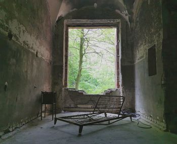 Empty chair in abandoned building