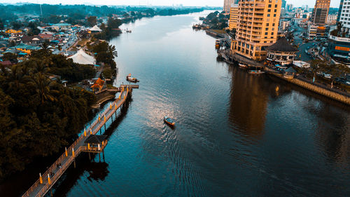 High angle view of sea by buildings in city