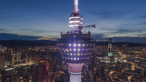 Aerial view of illuminated buildings in city at night