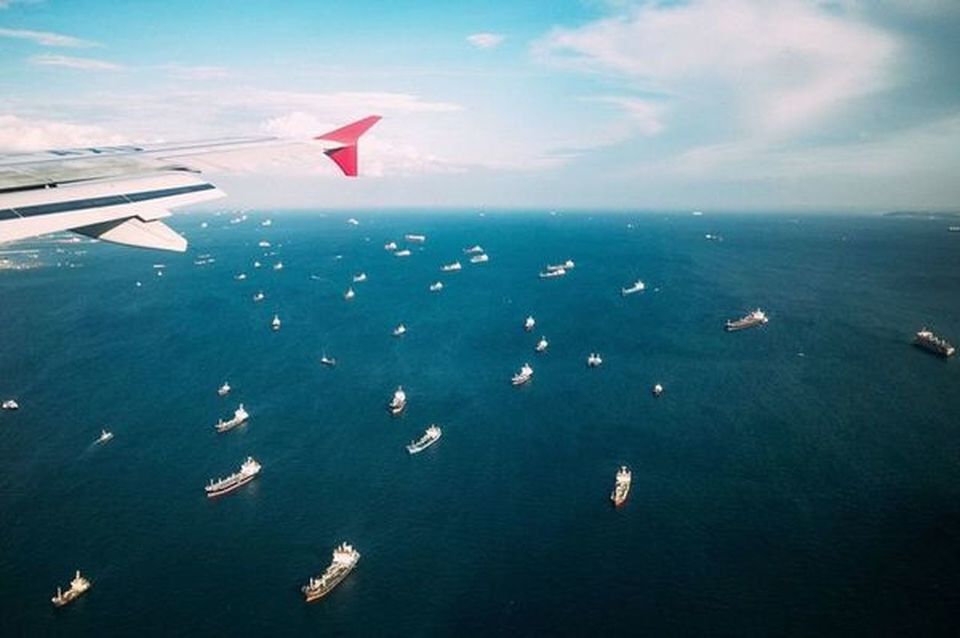 AIRPLANE FLYING OVER SEA