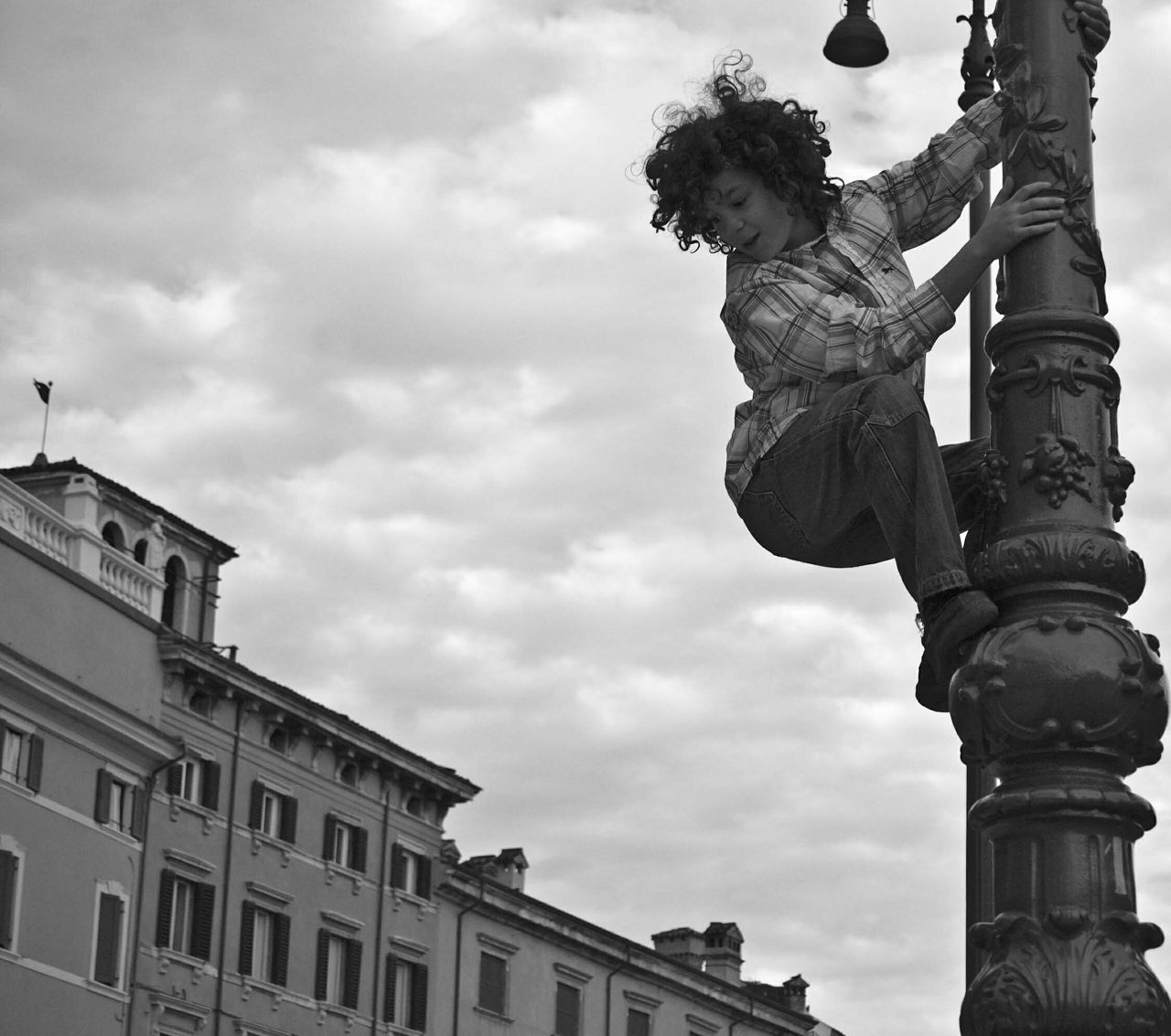 statue, low angle view, art and craft, sculpture, human representation, art, sky, architecture, creativity, built structure, building exterior, animal representation, cloud - sky, cloudy, outdoors, day, cloud, architectural column