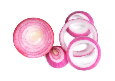 High angle view of pink petals on white background