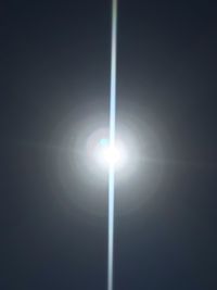 Close-up of illuminated street light against sky