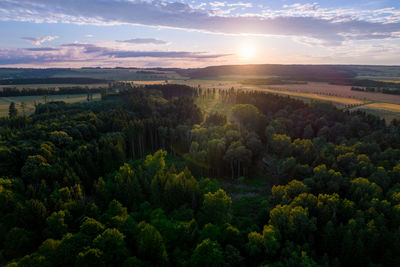 Scenic view of field against sky during sunset