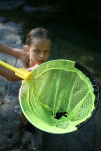 Portrait of girl holding water