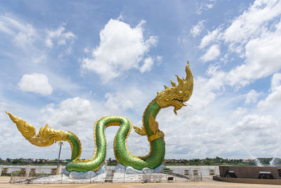 Low angle view of statue against sky