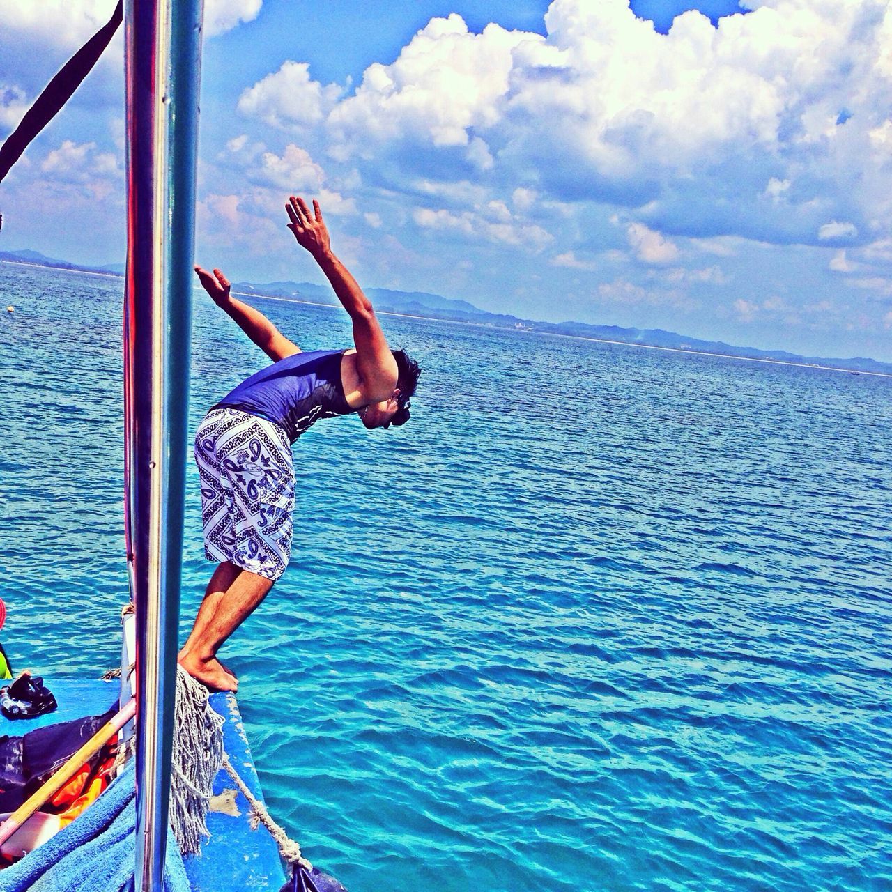 water, sea, lifestyles, leisure activity, sky, full length, horizon over water, vacations, cloud - sky, nautical vessel, young adult, men, rippled, blue, cloud, scenics, waterfront, rear view