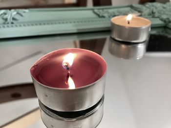 Close-up of tea light candle on table