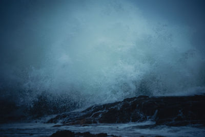 Sea waves splashing on rocks