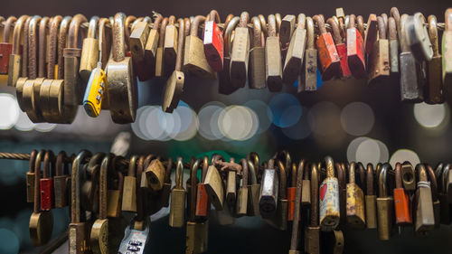 Close-up of padlocks hanging on metal