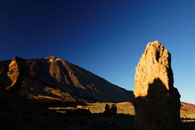 Scenic view of mountain against clear blue sky at teide national park