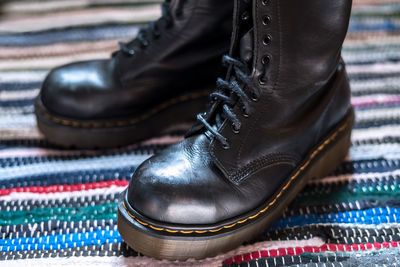 Close-up of leather shoes on rug