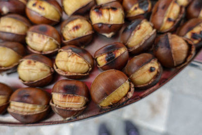 Full frame shot of roasted chestnuts for sale in market