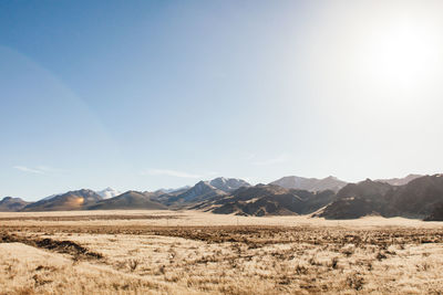 Scenic view of mountains against cloudy sky