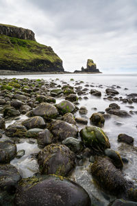 Scenic view of sea against cloudy sky