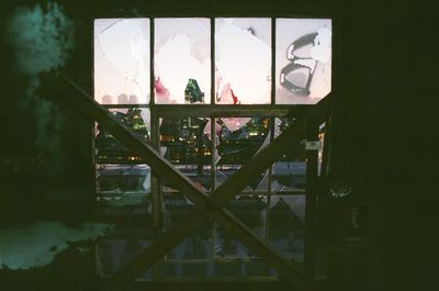 Close-up of glass window against building