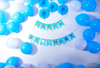 Low angle view of multi colored balloons