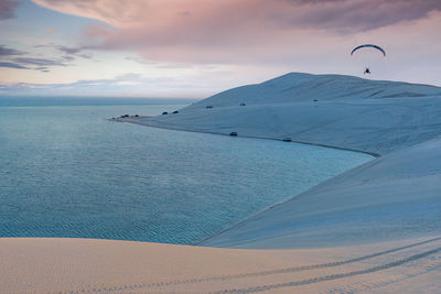 Desert at sunrise, morning glow over dunes inland sea of the sea line desert just out of doha,