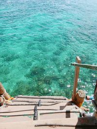 High angle view of steps to the beautiful emerald green sea.