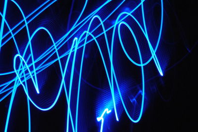 Close-up of light painting against black background