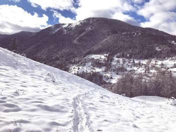 Scenic view of snowcapped mountains against sky