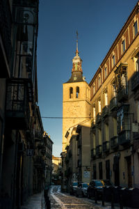 Looking up towards san miguel church tower in segovia, spain