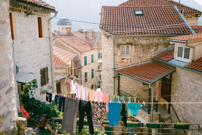 Houses against buildings in city