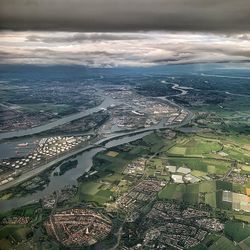 High angle view of river and cityscape against sky