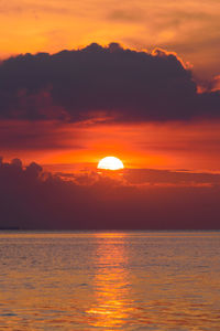 Scenic view of sea against romantic sky at sunset