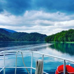 Boats sailing in sea against sky